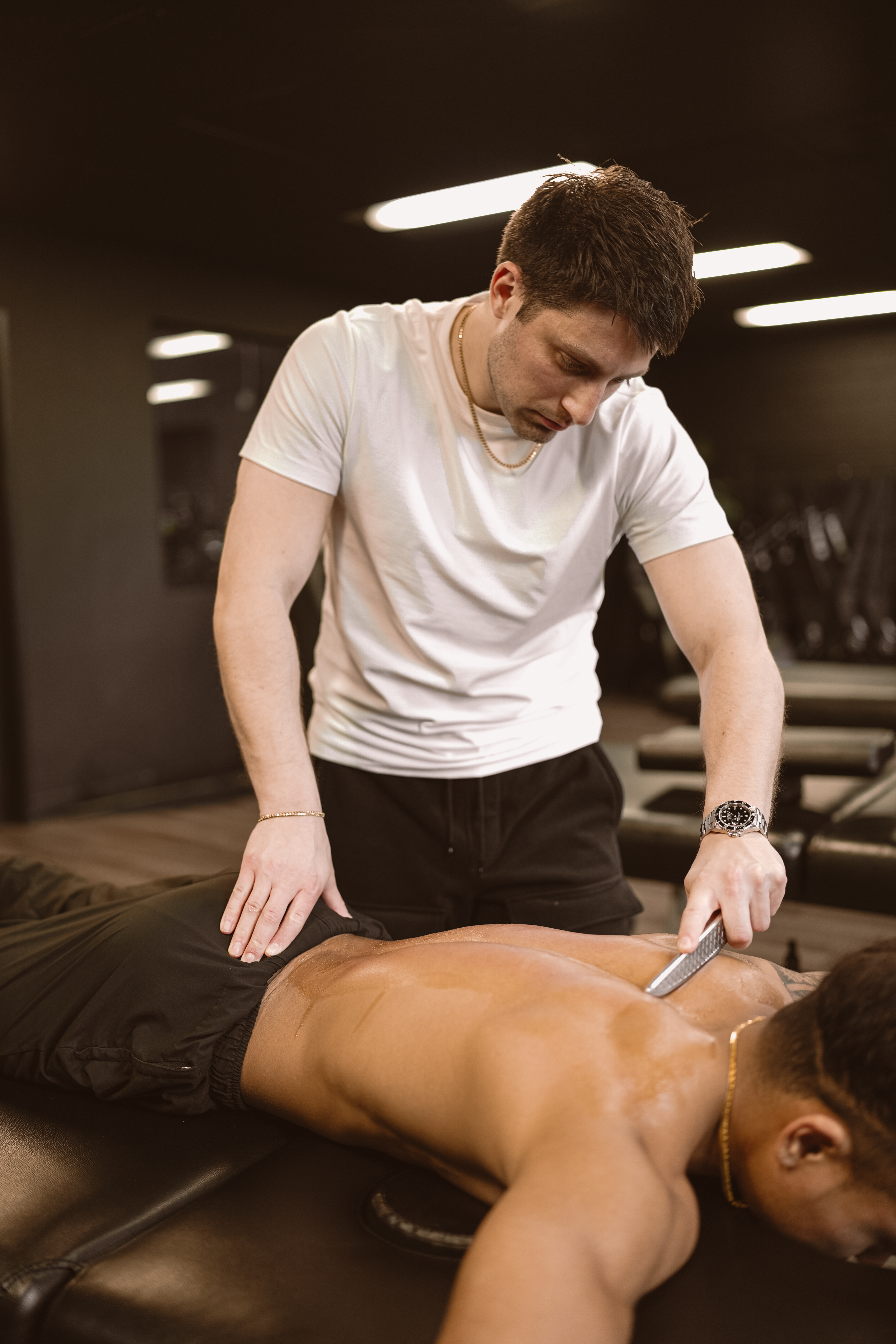 Dr. Sam performing chiropractic treatment